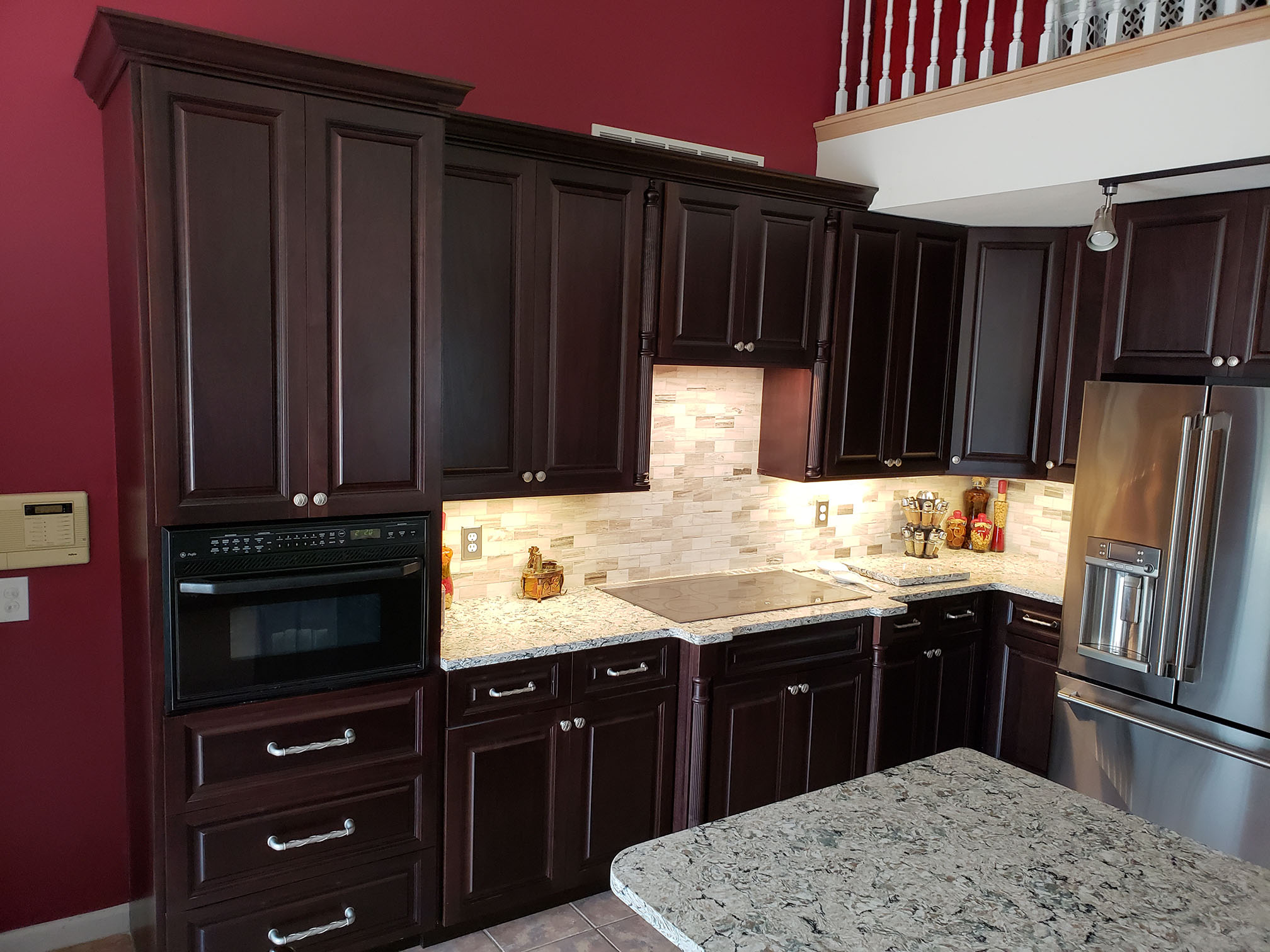 Dark wood kitchen remodel with modern appliances - custom cabinetry